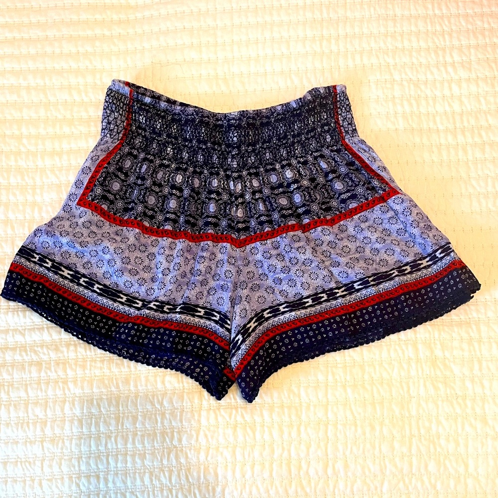 Red, white, and blue patterned shorts, size L